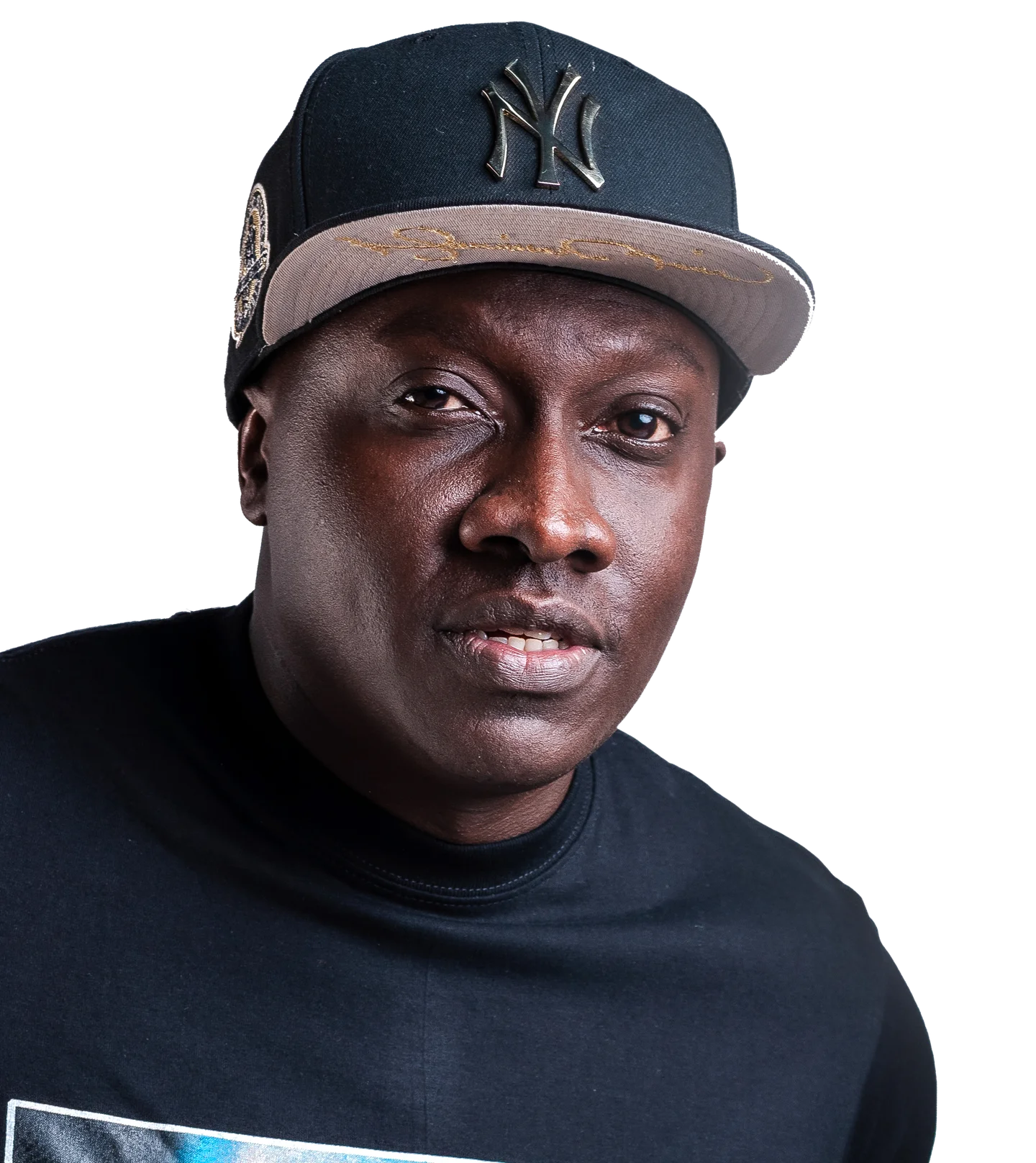 Head-and-shoulders portrait of Muzikal Sheriff in a dark cap.